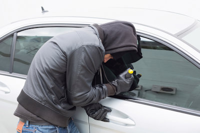 Man Breaking into a car