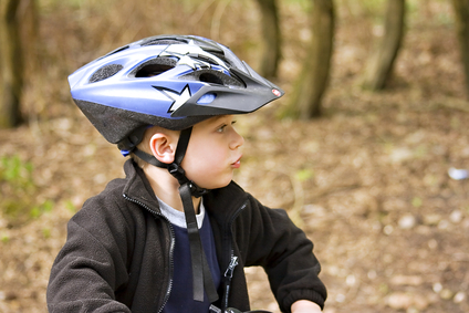 Child with helmet on a bicycle